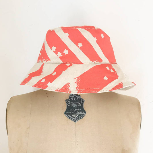 GRAPEFRUIT FLYING CARPET BUCKET HAT